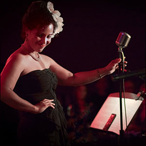 Stella Heath as Billie Holiday